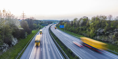 Germany, Baden-Wuerttemberg, traffic on Autobahn A8 at sunset - WDF05260