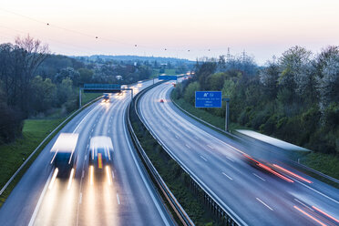 Germany, Baden-Wuerttemberg, traffic on Autobahn A8 at sunset - WDF05261