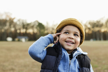 Mixed Race boy gesturing telephone in park - BLEF02944