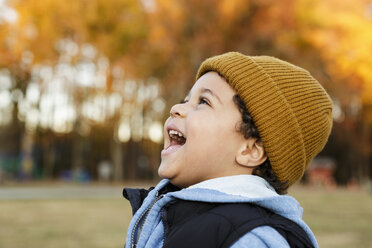 Mixed Race boy laughing in park - BLEF02945