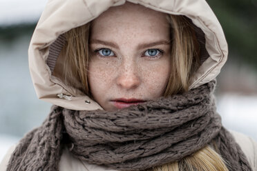 Caucasian woman wearing hood and scarf - BLEF02971