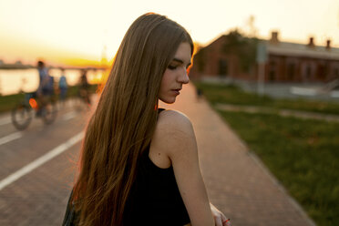 Pensive Caucasian woman at waterfront - BLEF02972