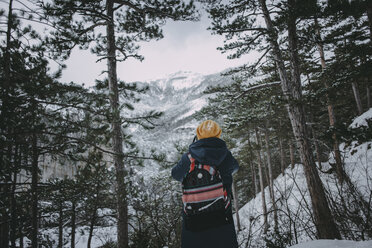 Caucasian woman admiring snowy forest - BLEF02995