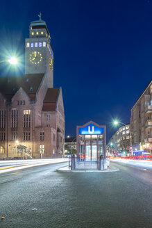Germany, Berlin-Neukoelln, view to city hall and underground station at night - TAMF01396