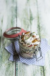 Glass of fried potato salad with cucumber, red radish, spring onions and mayonnaise yoghurt dressing - STBF00314