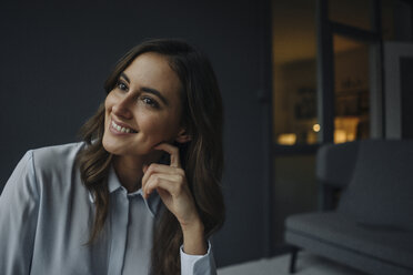 Portrait of smiling young businesswoman looking sideways - KNSF05768