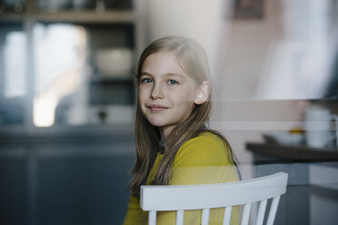 Portrait of a girl sitting on chair at home - KNSF05860