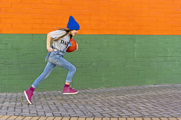 Young girl running with basketball - ERRF01240