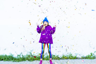 Girl wearing colorful clothing, confetti in front - ERRF01268