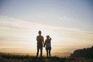 Caucasian couple admiring scenic view at sunset - BLEF03123