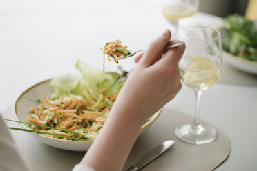 Close-up of woman eating a salad in a restaurant - AHSF00362