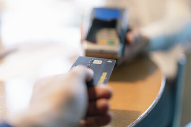 Man using credit card reader, close-up - DIGF07022