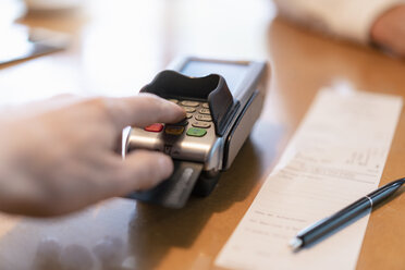 Man using credit card reader, close-up - DIGF07027