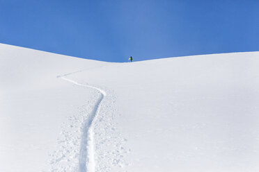 Austria, Tyrol, between Ischgl and Galtuer, Hohe Koepfe, ski tourer climbing up to the summit in winter - MMAF00937