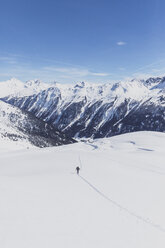 Austria, Tyrol, between Ischgl and Galtuer, Hohen Koepfen, ski tourer climbing up to the summit in winter - MMAF00938