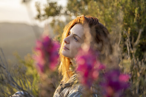 Dreaming redheaded woman in nature at sunset - AFVF02939