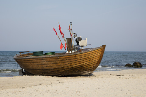 Germany, Ruegen, Binz, fishing boat at sandy beach stock photo