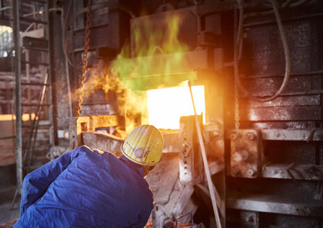 Industry, Smeltery: Worker checking blast furnace for fractures - CVF01194
