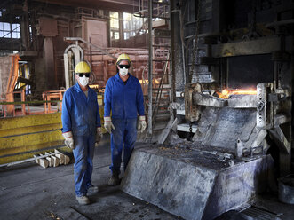Industry, Smeltery: Workers in front of blast furnace with helmet and dust mask - CVF01195