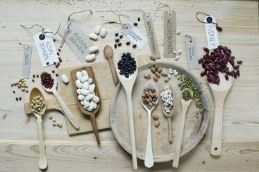 Variety of beans on wooden background - ASF06416