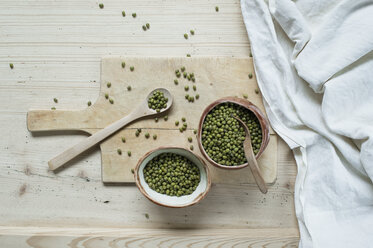 Split beans on wooden background - ASF06420