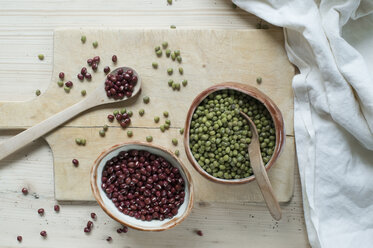 Split beans and Adzuki beans on wooden background - ASF06421