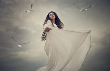 Birds flying near dancing Caucasian woman - BLEF03552