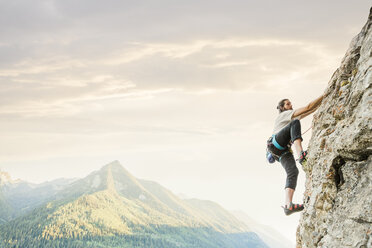 Caucasian man rock climbing - BLEF03592