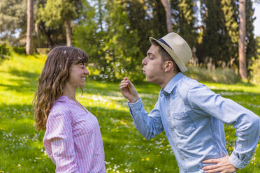 Romantic couple having fun in a park, Tuscany, Italy - MGIF00433