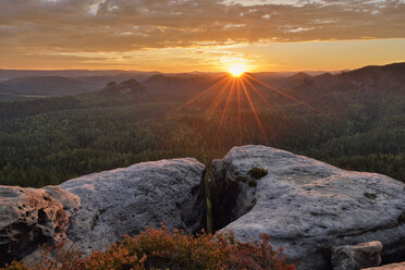 Germany, Saxony, Elbe Sandstone Mountains, view to the mountain Winterstein from the Gleitmannshorn at sunrise - RUEF02214