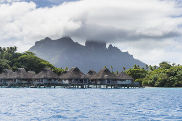 French Polynesia, Bora Bora, water bungalows of luxury hotel - RUNF02085