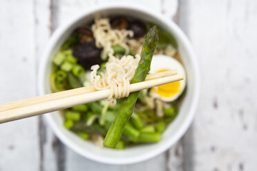 Bowl of Ramen soup with egg, green asparagus, noodles, shitake mushroom and spring onions - LVF08051