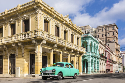 Vintage car driving in front of colonial buildings, Havana, Cuba - HSIF00615