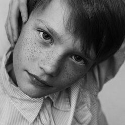 Close up of serious Caucasian boy with freckles - BLEF04044