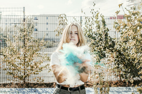 Girl with Holi powder colours, Germany stock photo