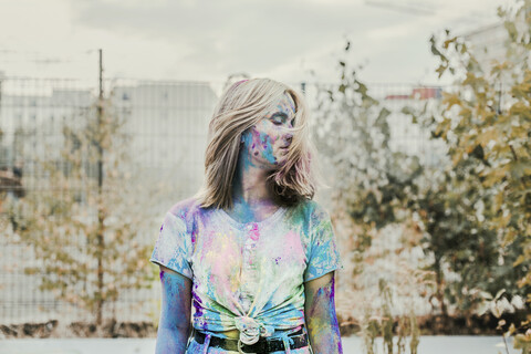 Gir Holi powder colours in her face, Germany stock photo