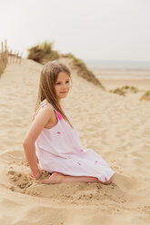 Portrait of girl sitting on the beach - NMS00307