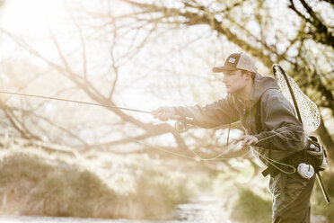 An Adult Is Holding A Fishing Reel, Stock Image 249250