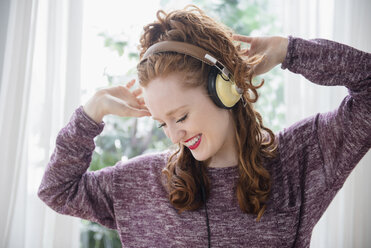 Caucasian woman listening to headphones and dancing - BLEF05061