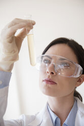 Caucasian scientist holding vial - BLEF05076