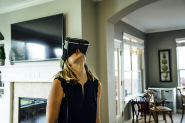 Caucasian woman wearing virtual reality goggles - BLEF05345