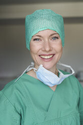 Portrait of smiling woman in scrubs - PNEF01491