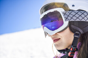 Snowy landscape reflected in ski goggles ofa woman, Sierra Nevada, Andalusia, Spain - JSMF01115