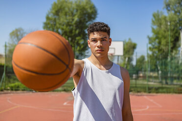 Young man playing basketball, giving the basketball - MGIF00496