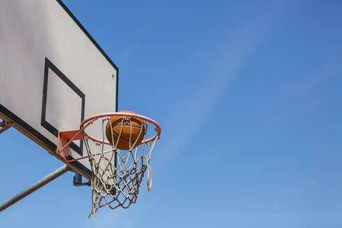 Basketball and hoop, blue sky - MGIF00520