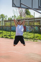 Young man playing basketball - MGIF00524