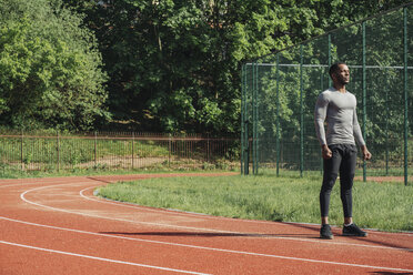 Sportsman standing on racetrack - AHSF00402