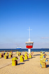 View to beach with hooded beach chairs and attendant's tower, Luebeck Travemuende, Germany - PUF01605