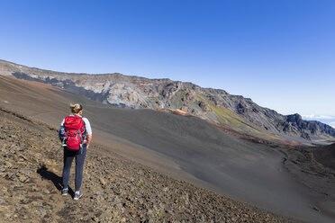 Tourist enjoying view from Sliding Sands Trail, Haleakala volcano, Haleakala National Park, Maui, Hawaii, USA - FOF10803