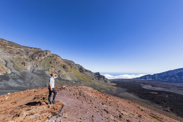 Tourist enjoying view from Sliding Sands Trail, Haleakala volcano, Haleakala National Park, Maui, Hawaii, USA - FOF10805